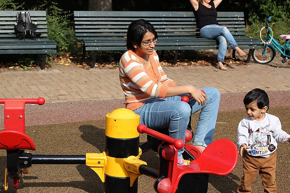 Anjali at playground with her son