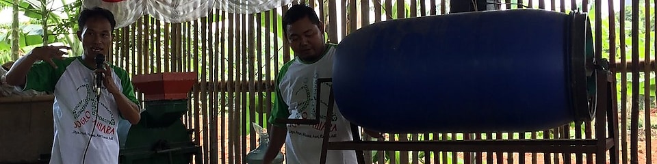 Two men showing the trash to cash process