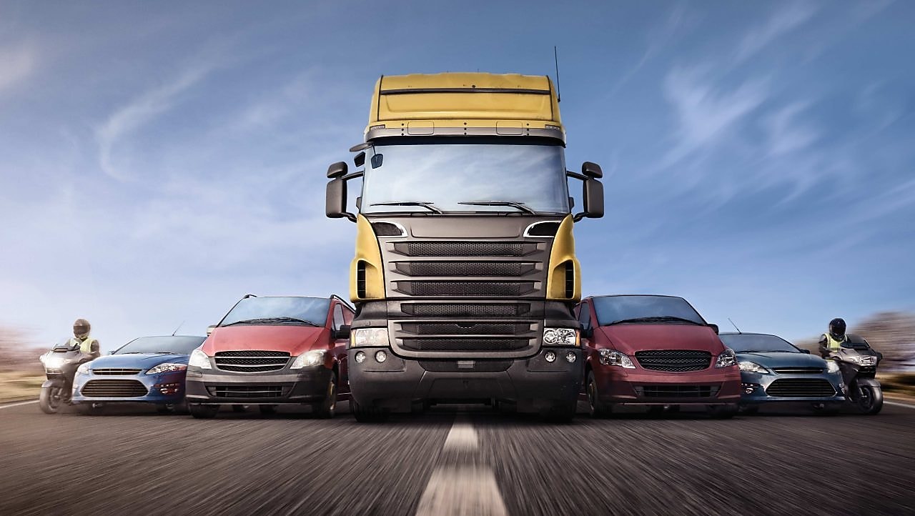 Cars and trucks in line on the road