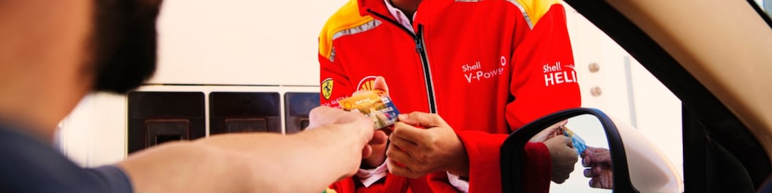 Man making payment by Shell card at petrol pump