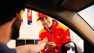 Man making payment by Shell card at petrol pump