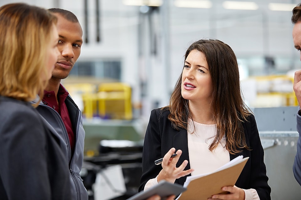 Manager discussing with colleagues