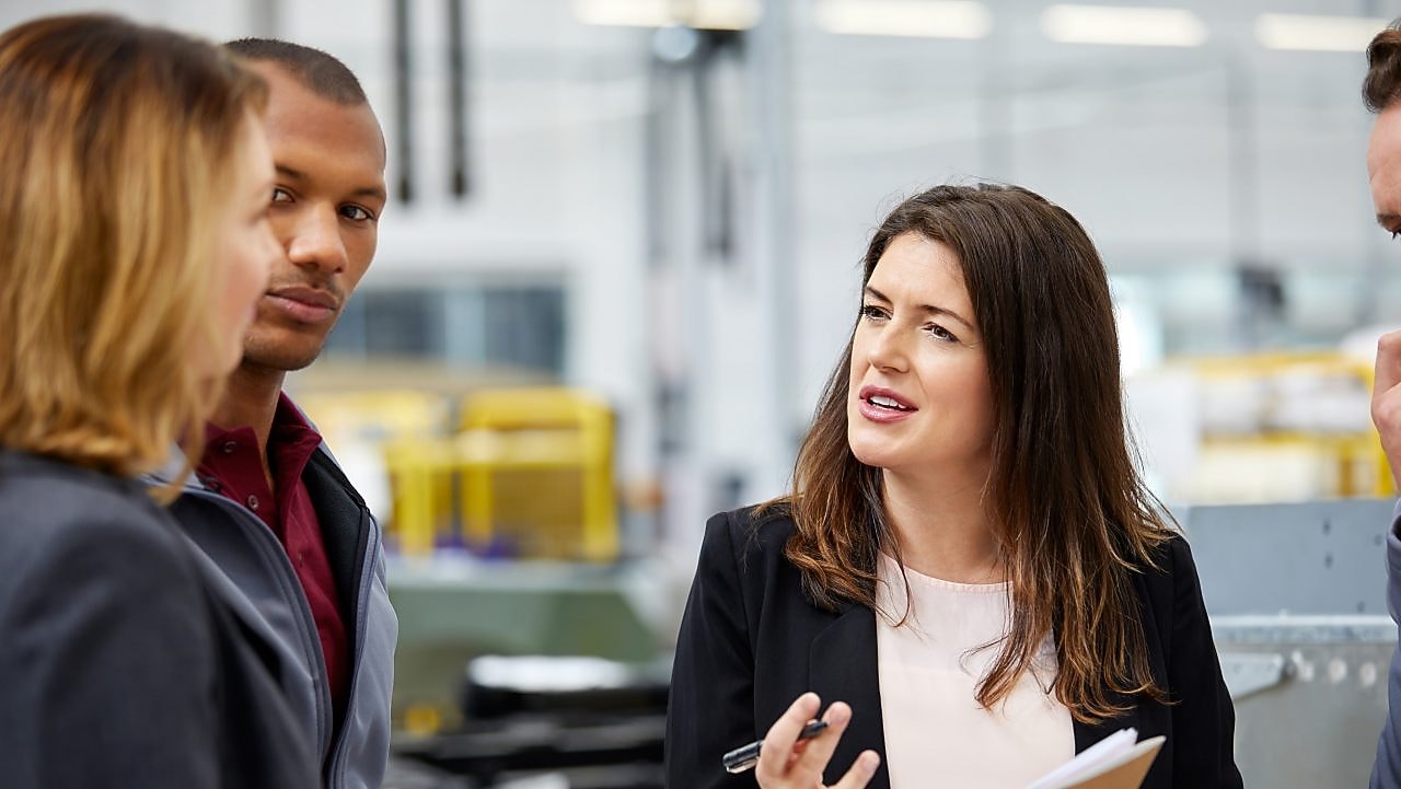 Manager discussing with colleagues