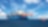 Large cargo vessel being pulled by tugboat