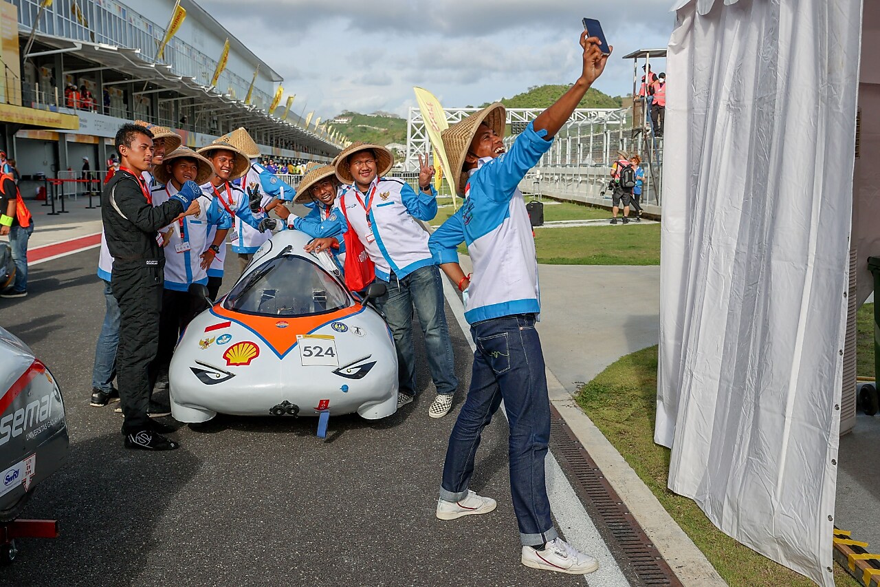 man taking selfie with team