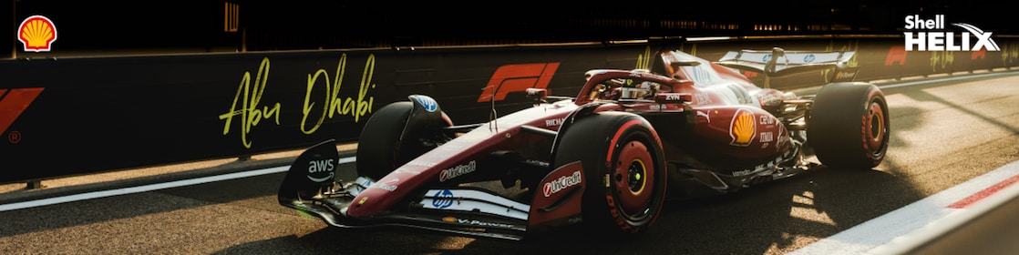 Mobil balap Ferrari sedang melaju di sirkuit Yas Marina, Abu Dhabi.