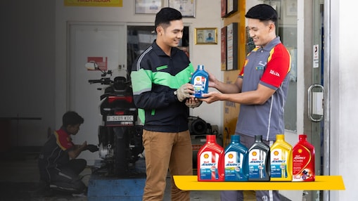 man and mechanic with vehicle lubricants