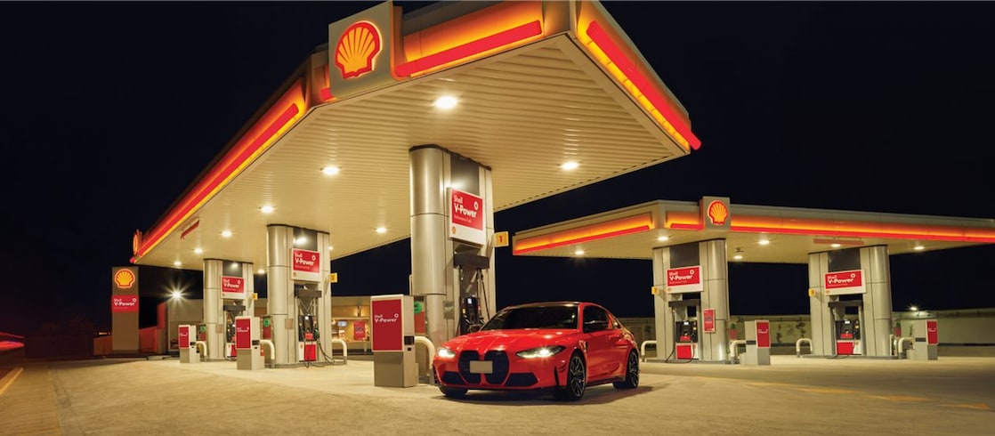Red car in shell  fuel station